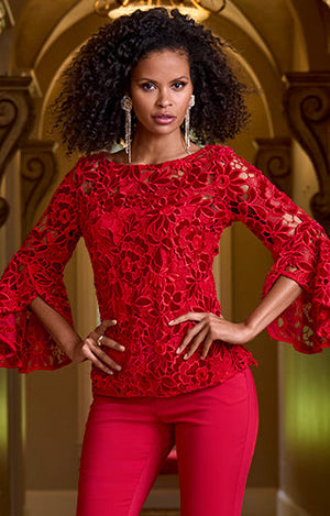 Models wearing a red lace top and red pants.